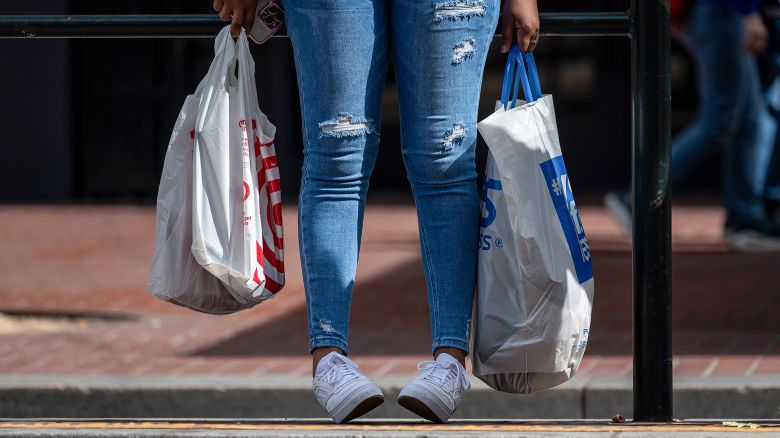 A shopper carries a Target and Ross Stores bag in San Francisco, California, on Tuesday, April 15, 2025.