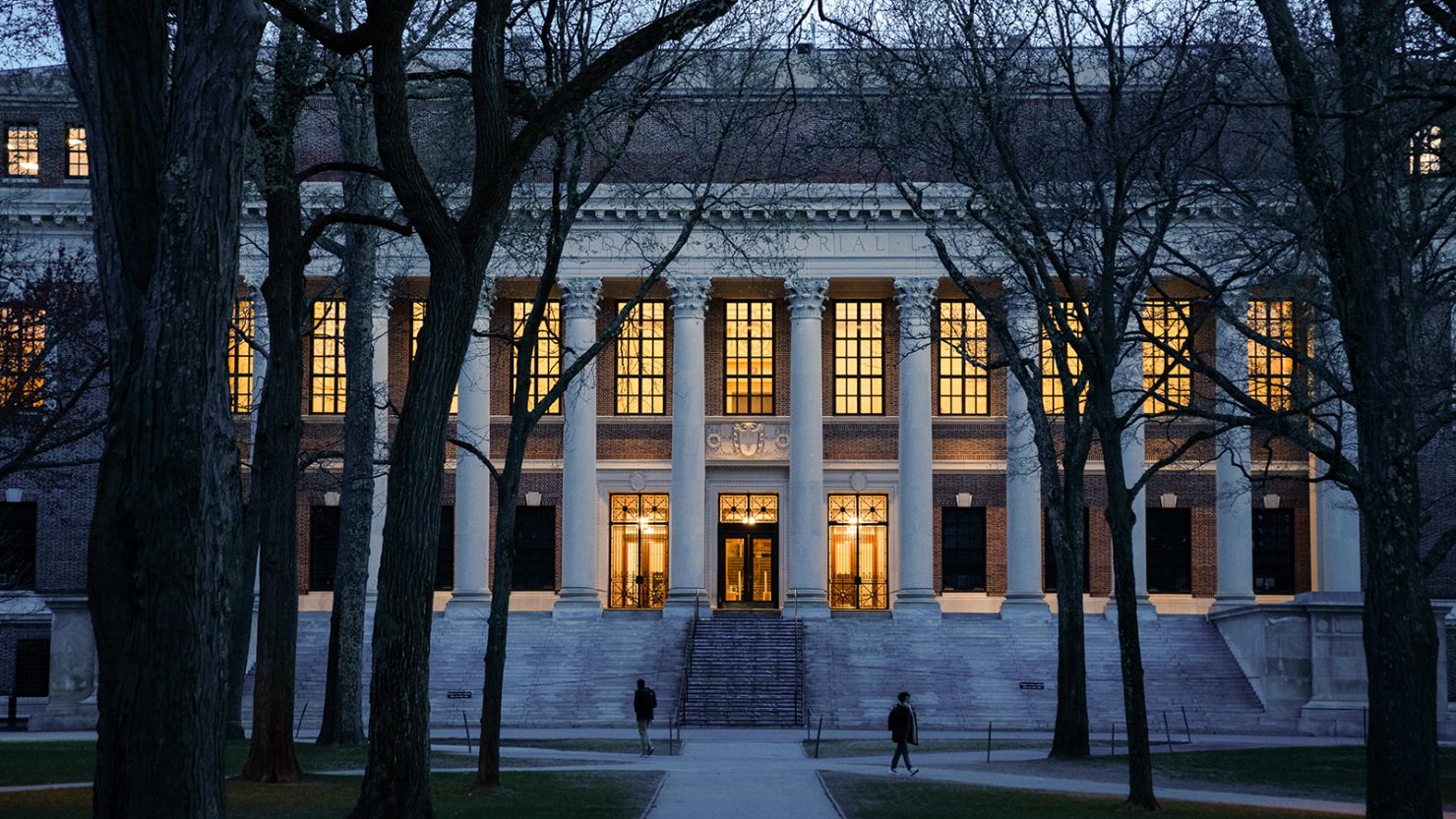 Pedestrians walk through Harvard Yard on the Harvard University campus in Cambridge, Massachusetts on Wednesday.