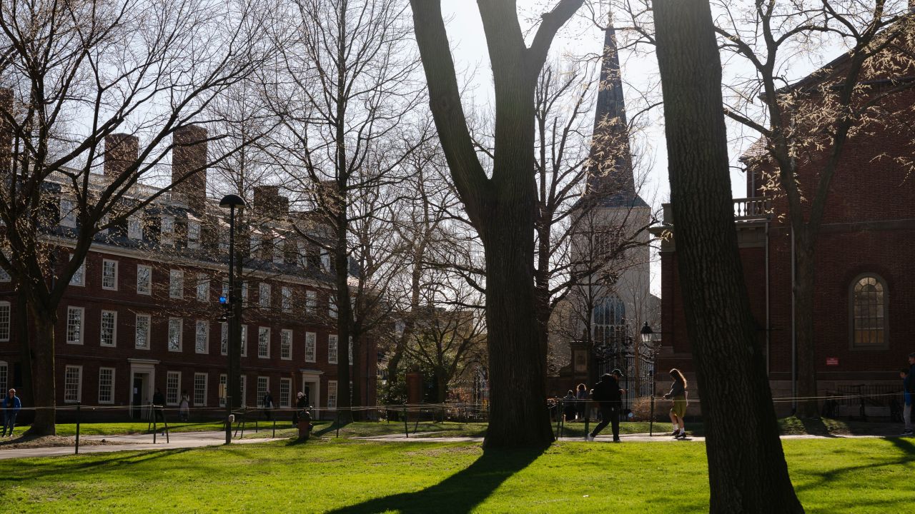 People walk through campus at Harvard University on April 17, 2025, in Cambridge, Massachusetts. The Trump administration announced that it would block Harvard University from receiving $2.2 billion in federal grants and $60 million in contracts after the school refused demands to adopt new policies relating to student and faculty conduct, admissions, anti-semitism on campus and DEI.
