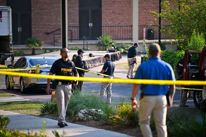 Police investigate the scene of a shooting near the student union at Florida State University on April 17, 2025 in Tallahassee, Florida.