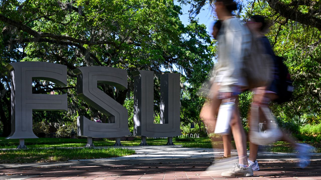 TALLAHASSEE, FLORIDA - APRIL 18: Florida State University students walk near the scene of a shooting near the Florida State University student center on April 18, 2025 in Tallahassee, Florida. Two people were reported dead and several others injured when the suspected shooter, believed to be a student and the son of a Leon County Sheriff deputy, opened fire on the university main campus. (Photo by Miguel J. Rodriguez Carrillo/Getty Images)