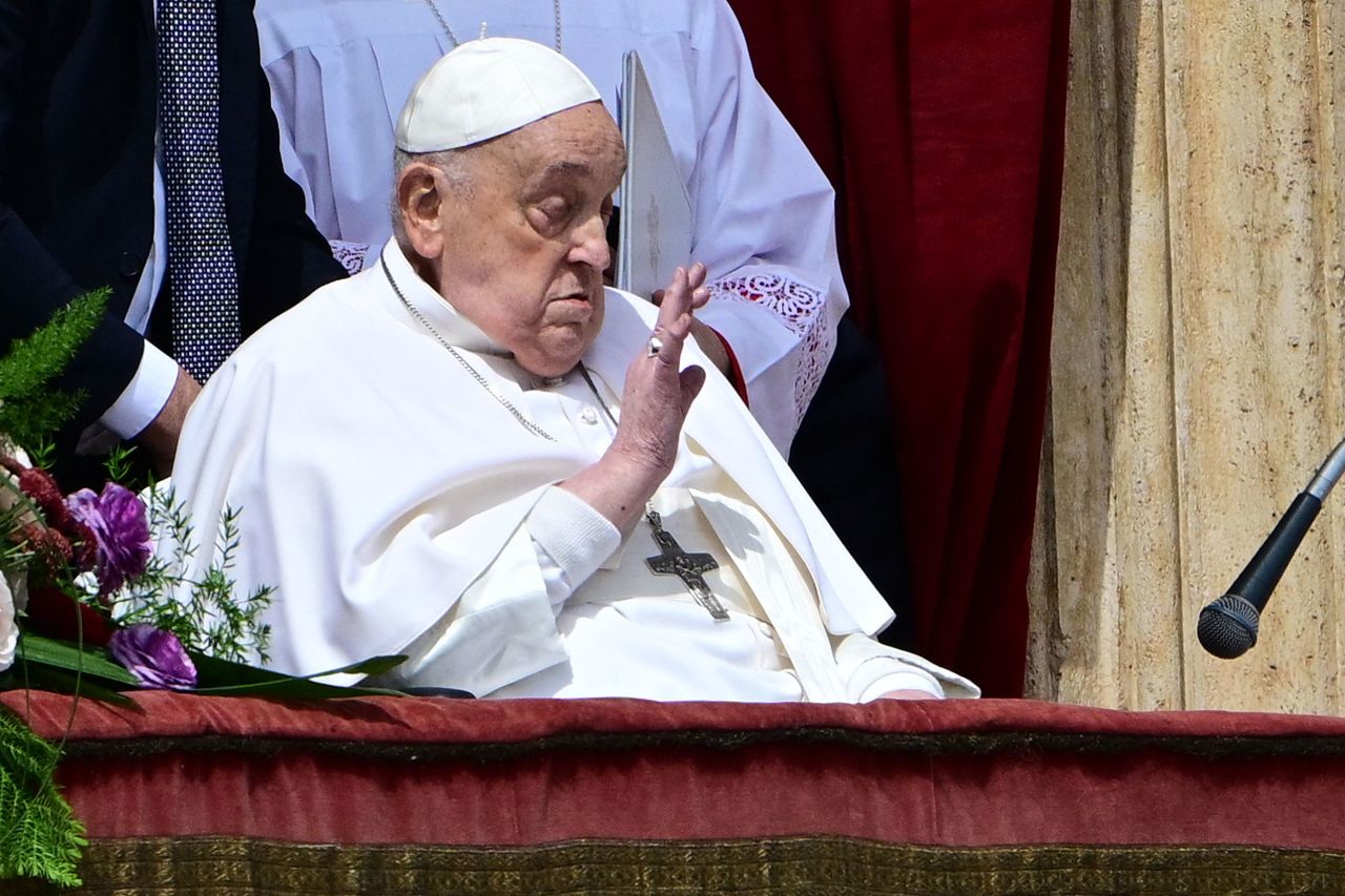 Pope Francis waves from the main balcony of St. Peter's basilica for the Urbi et Orbi message and blessing to the city and the world as part of Easter celebrations, at St Peter's square in the Vatican on April 20, 2025. (Photo by Tiziana FABI / AFP) (Photo by TIZIANA FABI/AFP via Getty Images)
