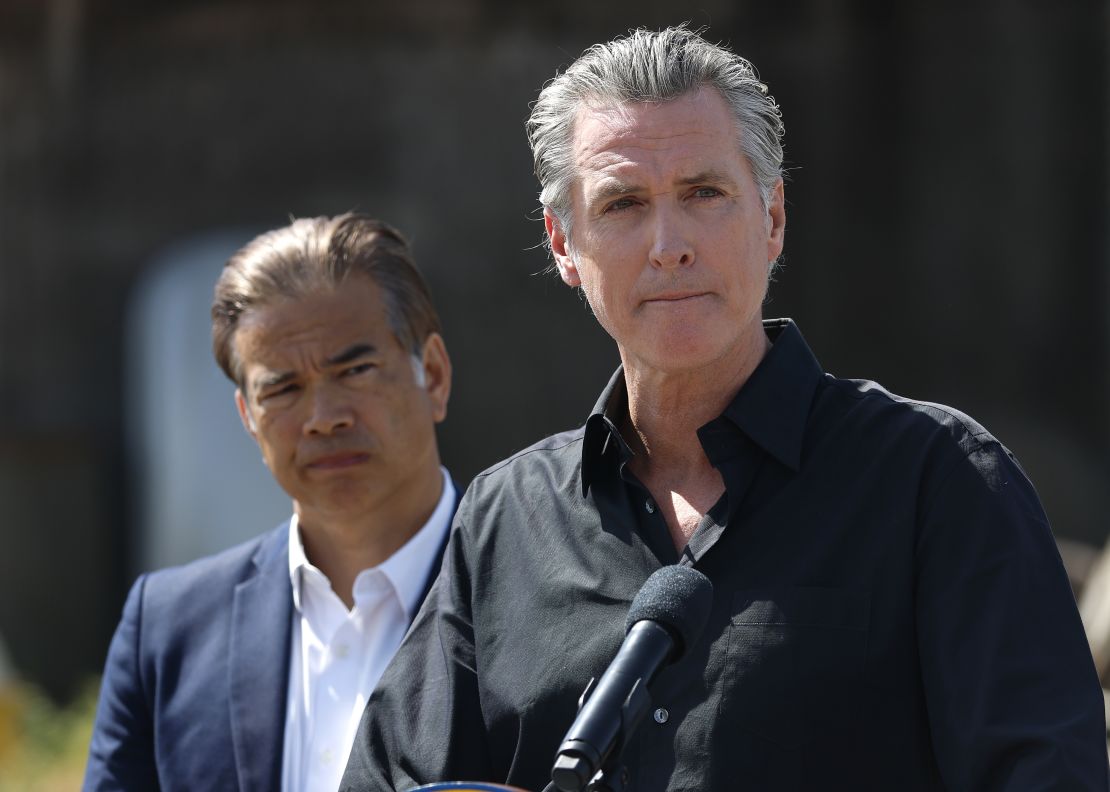 California Gov. Gavin Newsom, right, and California Attorney General Rob Bonta look on during a news conference on April 16, 2025, in Ceres, California.