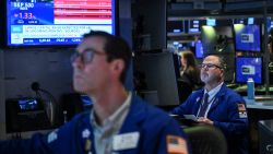 Traders work on the floor of the New York Stock Exchange (NYSE) at the opening bell on April 21, 2025, in New York. Wall Street stocks opened lower Monday amid lingering uncertainty over President Trump's trade policy as markets looked ahead to major earnings later in the week. China on Monday hit out at other countries negotiating trade deals with the United States at Beijing's expense, vowing countermeasures against those who "appease" Washington.
