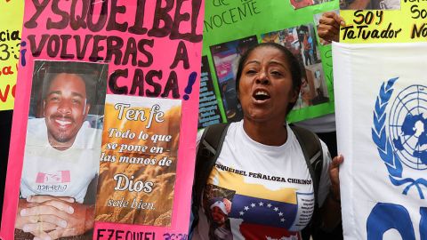 A relative of a Venezuelan migrant deported from the US to a mega-prison in El Salvador holds a sign during a protest to demand his freedom in Caracas on April 22, 2025. Relatives of migrants deported from the US to a mega-prison in El Salvador rejected on April 22, 2025, the prisoner exchange proposal made by Salvador's President Nayib Bukele to the Venezuelan government. (Photo by Pedro MATTEY / AFP) (Photo by PEDRO MATTEY/AFP via Getty Images)