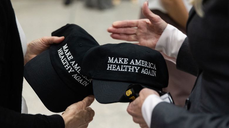 WASHINGTON, DC, UNITED STATES - APRIL 22: Make America Healthy Again hats are given out at a news conference on removing synthetic dyes from America's food supply, at the Health and Human Services Headquarters in Washington, DC on April 22, 2025. (Photo by Nathan Posner/Anadolu via Getty Images)