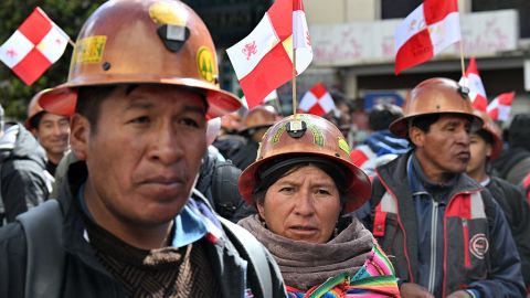 Mining workers block an avenue during a march to demand the government of Bolivian President Luis Arce find a solution to the lack of dollars and fuel shortages in La Paz on April 23, 2025. (Photo by AIZAR RALDES / AFP) (Photo by AIZAR RALDES/AFP via Getty Images)          