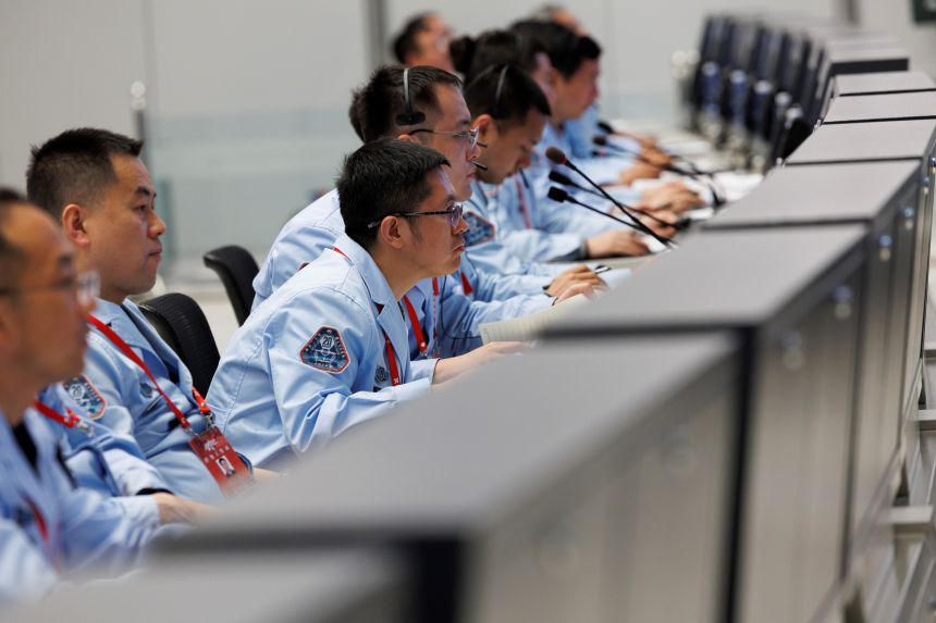 Technical personnel at Beijing Aerospace Control Center monitor the docking of the Shenzhou-20 crewed spacecraft with Tiangong space station on April 24.
