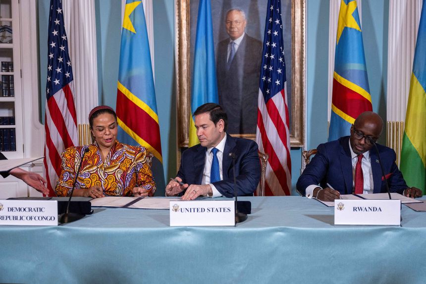 US Secretary of State Marco Rubio (C), Rwandan Foreign Minister Olivier Nduhungirehe (R) and DR Congo Foreign Minister Therese Kayikwamba Wagner sign a Declaration of Principles between the two countries in the Treaty Room of the State Department in Washington, DC, on April 25, 2025.