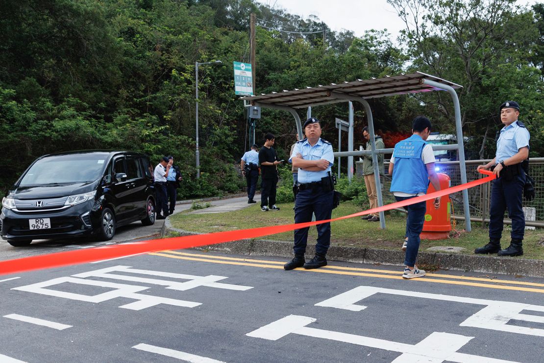 Police officers stand outside Hong Kong's Shek Pik prison on April 29, 2025.