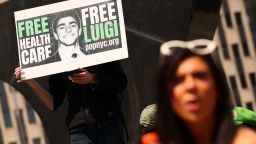 NEW YORK, NEW YORK - APRIL 25: People gather at Foley Square to  Luigi Mangione, accused gunman in the killing of UnitedHealthcare CEO Brian Thompson, as he is arraigned on federal charges at Manhattan Federal Court on April 25, 2025 in New York City. Mangione appeared in federal court and entered a not guilty plea on charges of stalking and murder. He appeared in court a week after a federal grand jury indicted him on four federal charges in the December 4 killing of the insurance executive Brian Thompson. Attorney General Pam Bondi has announced that the Justice Department has filed a notice that they intend to seek the death penalty in the case. Mangione also faces state charges in New York and Pennsylvania related to the shooting and its week long manhunt. (Photo by Michael M. Santiago/Getty Images)