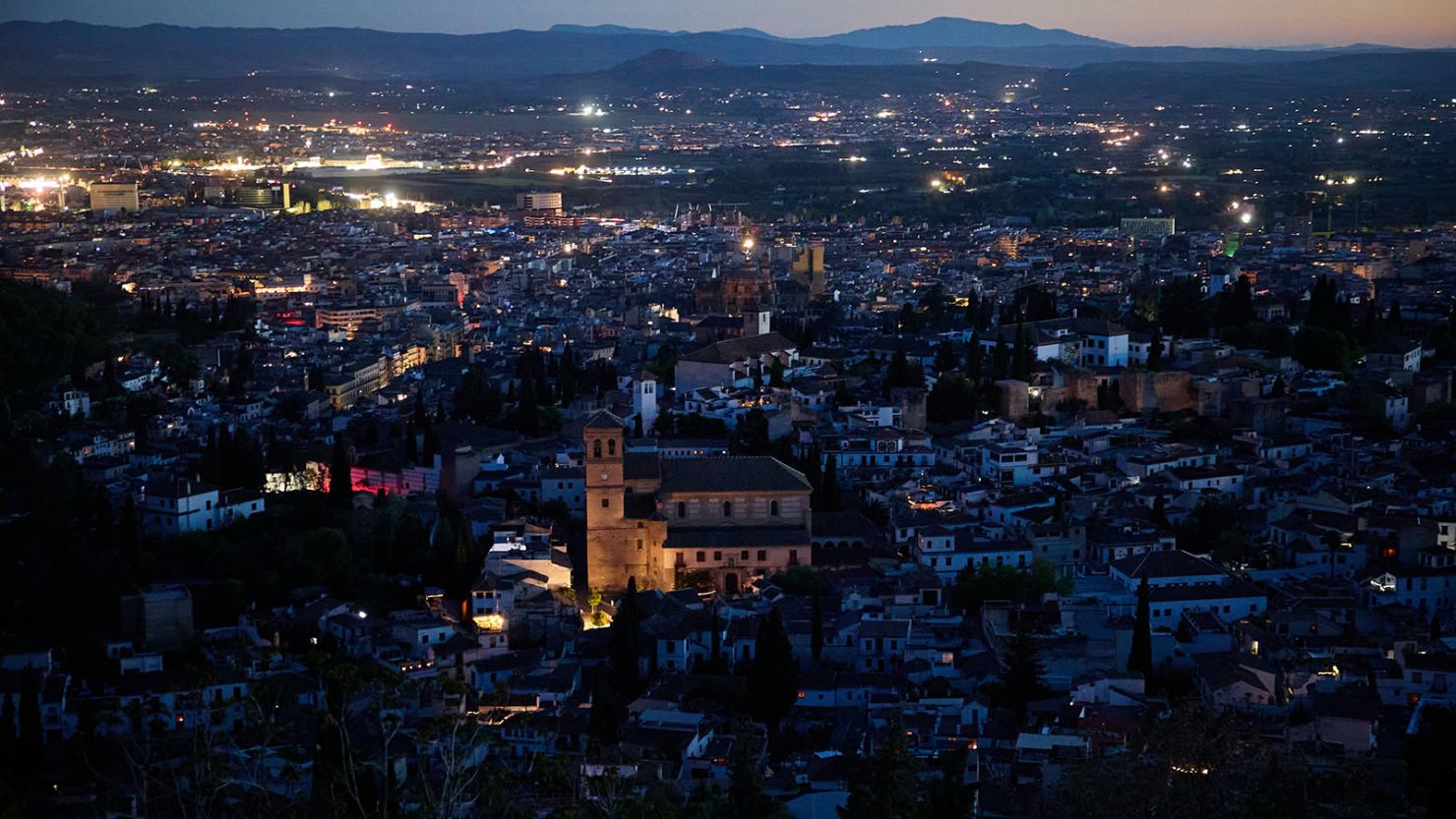 A general view of the city of Granada, with the Alhambra, is plunged into darkness during the power outage that affects Spain nationwide in Granada, Spain on April 28, 2025.