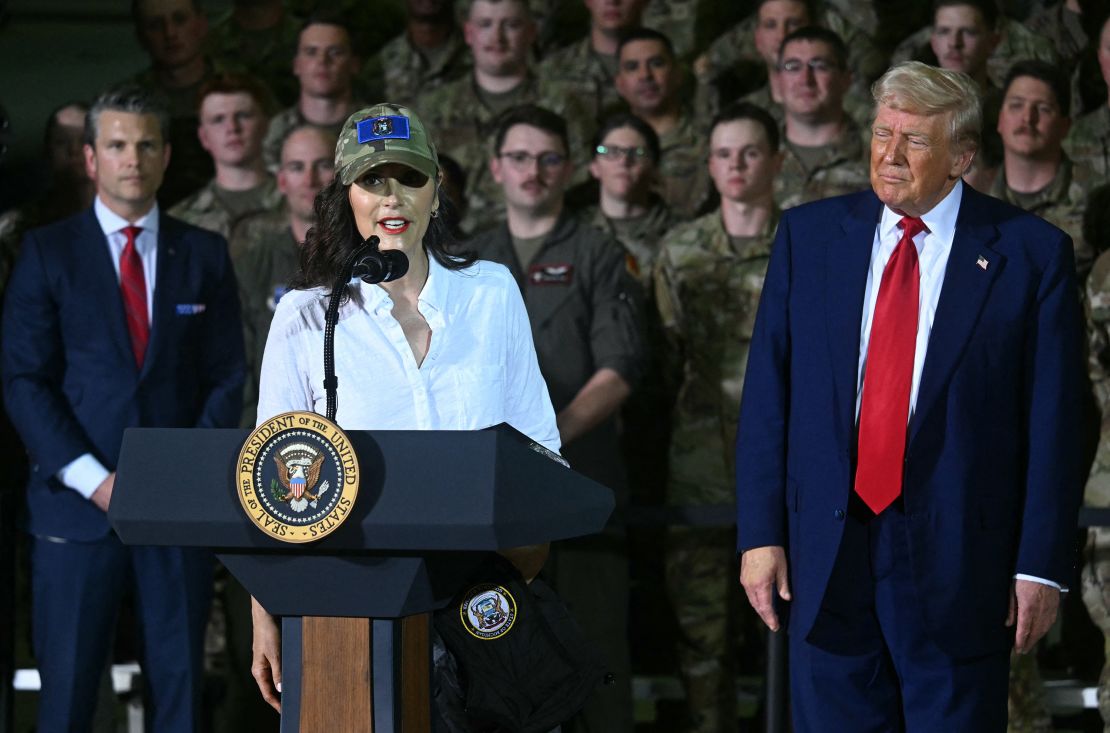 Michigan Governor Gretchen Whitmer speaks as US Secretary of Defence, Pete Hegseth (L), and US President Donald Trump (R) look on during remarks to the Michigan National Guard at Selfridge Air National Guard Base in Warren, Michigan, on April 29, 2025.