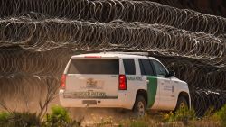 A US Customs and Border Protection (CBP) Border Patrol vehicle drives past recently installed concertina wire on a section of border wall fencing along the US-Mexico border between San Diego and Tijuana in San Diego, California on April 24, 2025. (Photo by Patrick T. Fallon / AFP) (Photo by PATRICK T. FALLON/AFP via Getty Images)          
