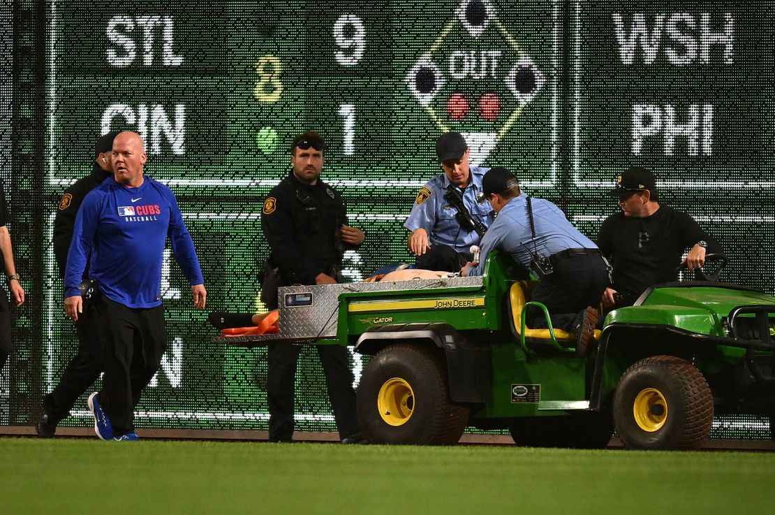 A fan is carted off the field after falling from the stands at PNC Park.