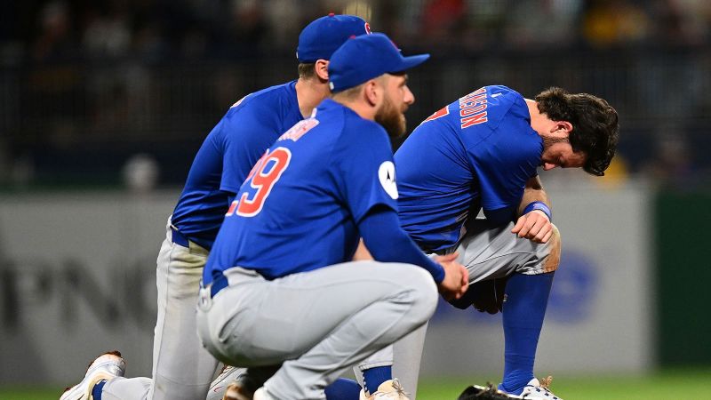 Fan hospitalized after scary fall from outfield wall during Cubs and Pirates game | CNN