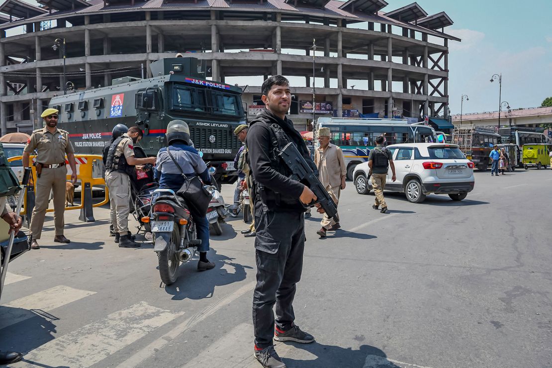 A policeman stands guard at a checkpoint along a street in Srinagar on May 1, 2025.