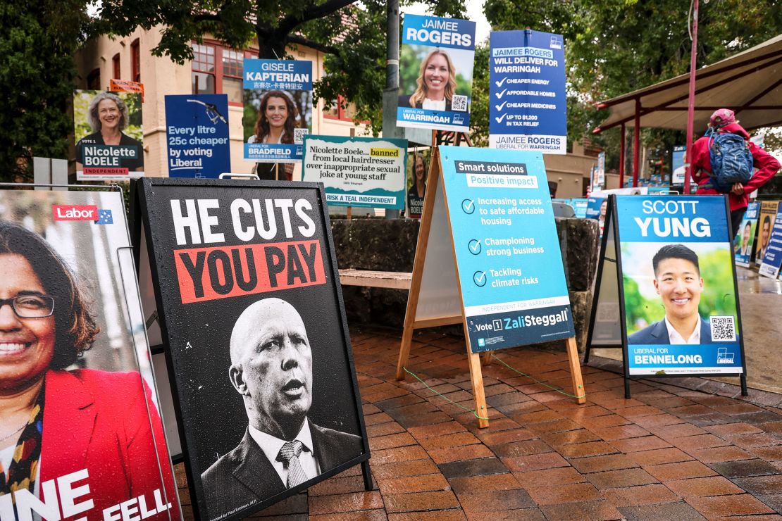 Signs for competing candidates crowd the entrance to a pre-polling center in Sydney on May 2.