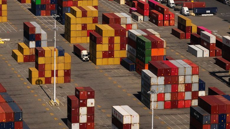 Shipping containers are stacked at the Port of Oakland in Oakland, California. On Friday, President Donald Trump enacted a new round of tariffs bringing rates to the highest levels in modern history.