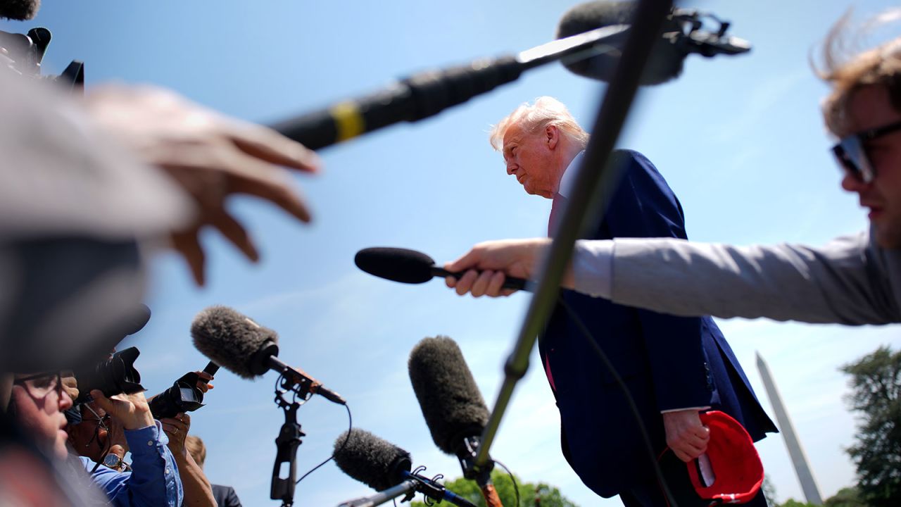 President Donald Trump speaks to members of the media before boarding Marine One on the South Lawn of the White House on April 29,,in Washington, DC.