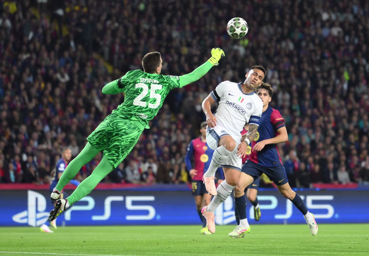 Barcelona goalkeeper Wojciech Szczęsny punches the ball clear in the first half.