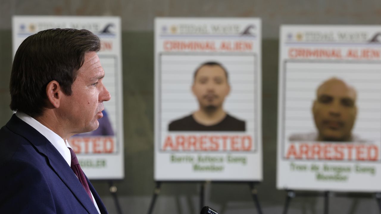 MIRAMAR, FLORIDA - MAY 01: Florida Gov. Ron DeSantis speaks during a press conference, in front of posters of people that law enforcement arrested, held at the ICE-Enforcement and Removal Operation office on May 01, 2025 in Miramar, Florida. DeSantis talked about a multi-agency immigration enforcement effort named Operation Tidal Wave that they say resulted in more than 1,100 arrests in a single week in Florida. (Photo by Joe Raedle/Getty Images)