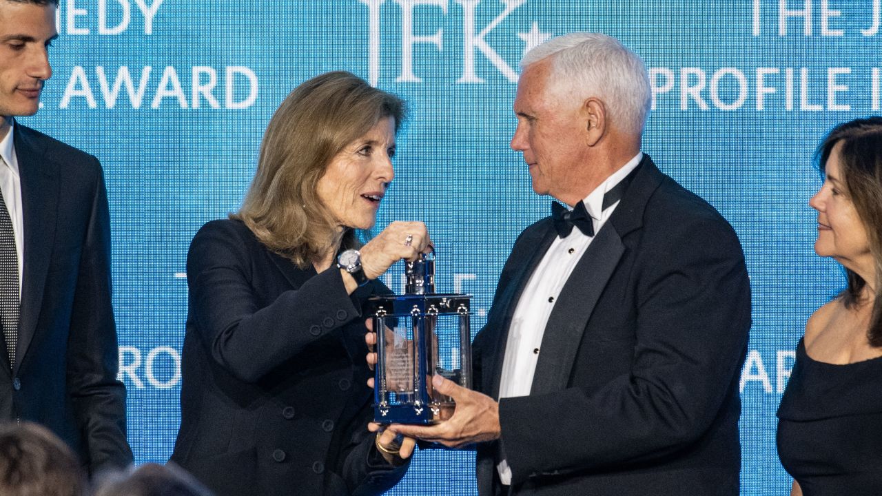 Former US Vice President Mike Pence, standing with his wife Karen Pence, receives the 2025 John F. Kennedy Profile in Courage Award from Caroline Kennedy and Jack Schlossberg at the John F. Kennedy Presidential Library and Museum in Boston, Massachusetts on May 4, 2025. (Photo by Joseph Prezioso / AFP) (Photo by JOSEPH PREZIOSO/AFP via Getty Images)          