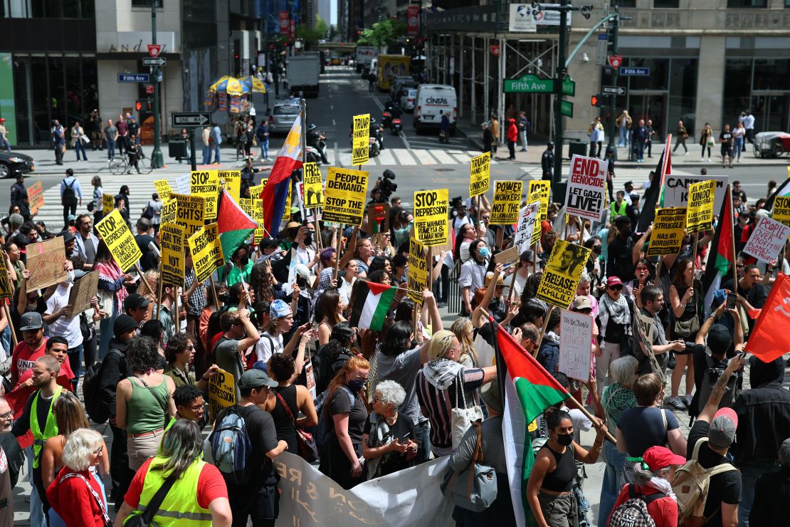 People gather at New York Public Library after marching during a May Day rally on Thursday.