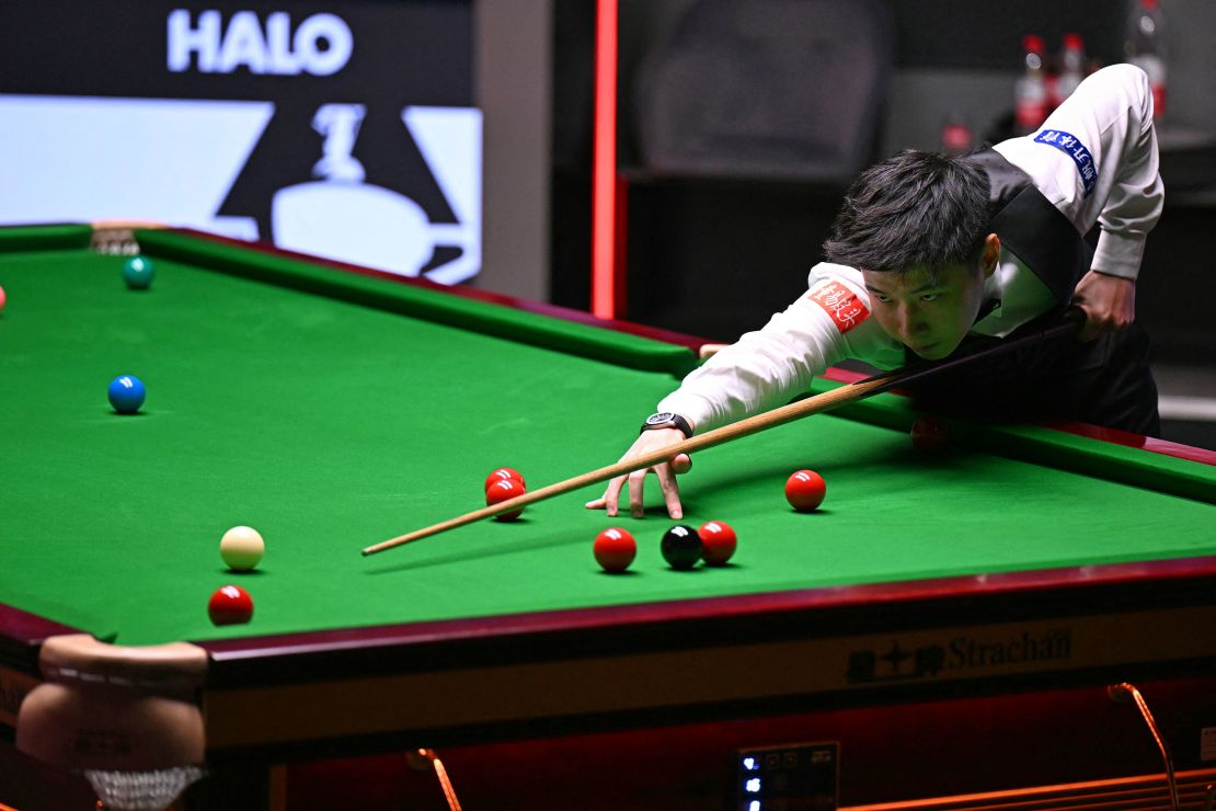 Zhao Xintong plays a shot during the World Championship Snooker final on May 5, 2025.