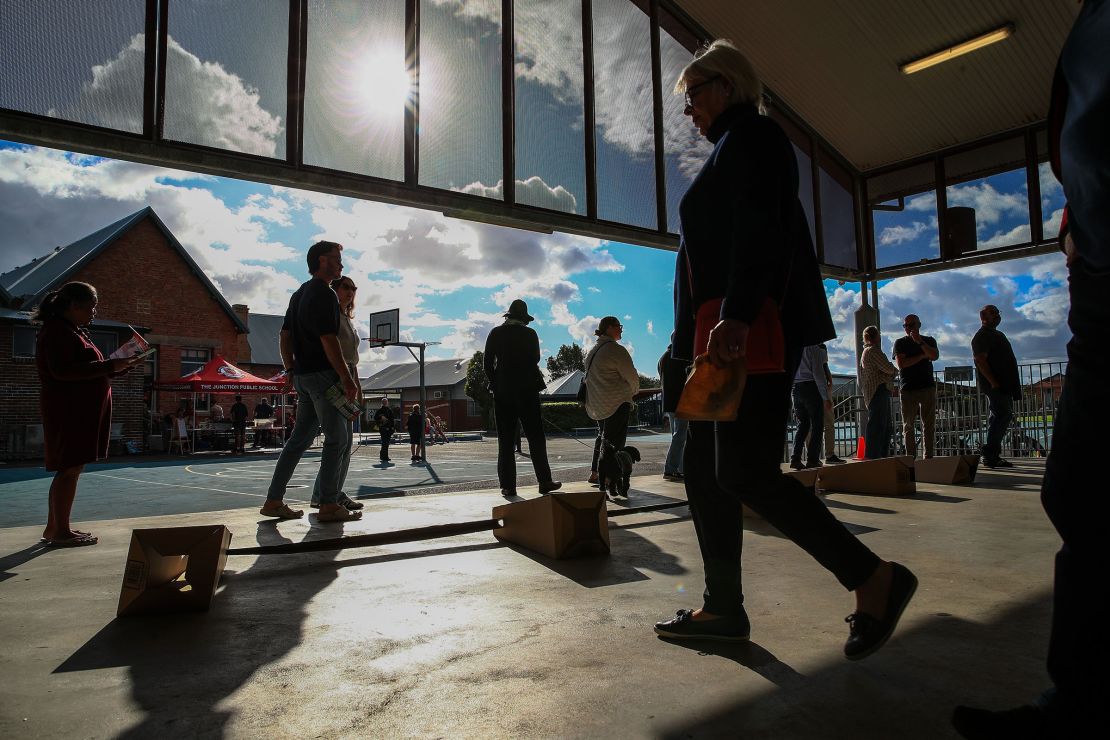 People line up to cast their vote at The Junction Public School in Newcastle on Saturday.