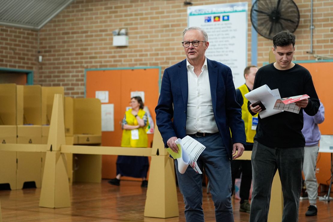 Australian Prime Minister Anthony Albanese and his son Nathan prepare to vote at Marrickville West Public School in Sydney on Saturday.