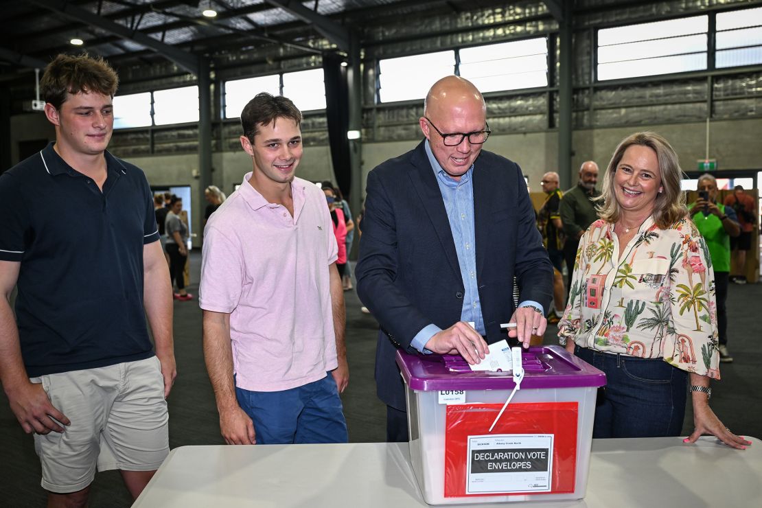 Opposition Leader Peter Dutton casts his vote, alongside his wife Kirilly and sons Harry and Tom, at the Albany Creek State School in Brisbane on Saturday.