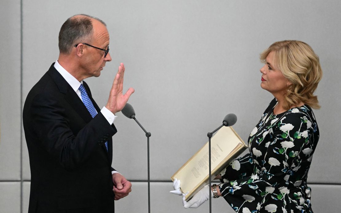 German Chancellor Friedrich Merz takes the oath of office during a swearing-in ceremony at the Bundestag (lower house of parliament) in Berlin on May 6, 2025.