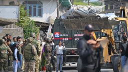 A bulldozer carries a fuel tank of an aircraft in Wuyan, near Srinagar on May 7, 2025. India and Pakistan exchanged heavy artillery along their contested frontier on May 7, after New Delhi launched missile strikes on its arch-rival in a major escalation between the nuclear-armed neighbours. New Delhi announced it had carried out "precision strikes at terrorist camps" at nine sites in Pakistan-administered Kashmir, days after it blamed Islamabad for a deadly attack on the Indian-run side of the disputed region. (Photo by Tauseef MUSTAFA / AFP) (Photo by TAUSEEF MUSTAFA/AFP via Getty Images)          