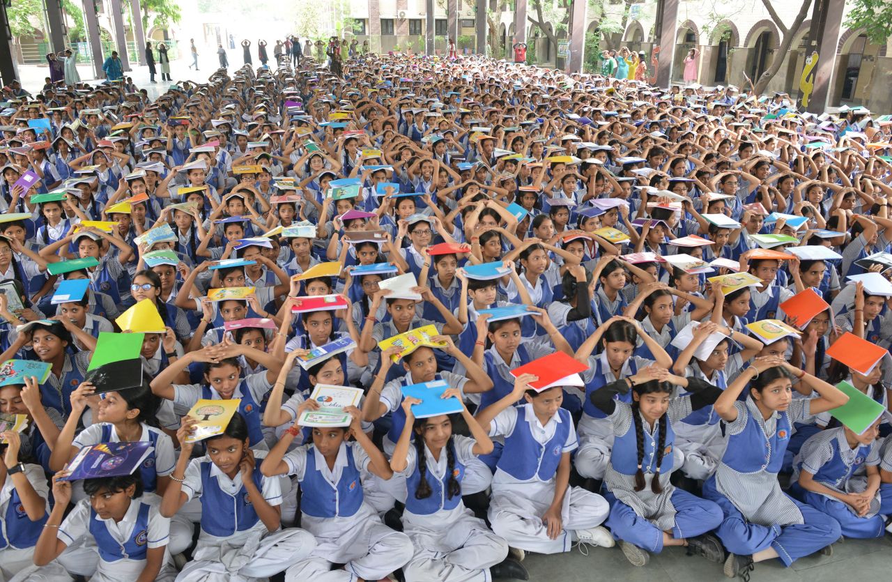 Students participate in a drill at Delhi Government School in New Delhi on Wednesday.