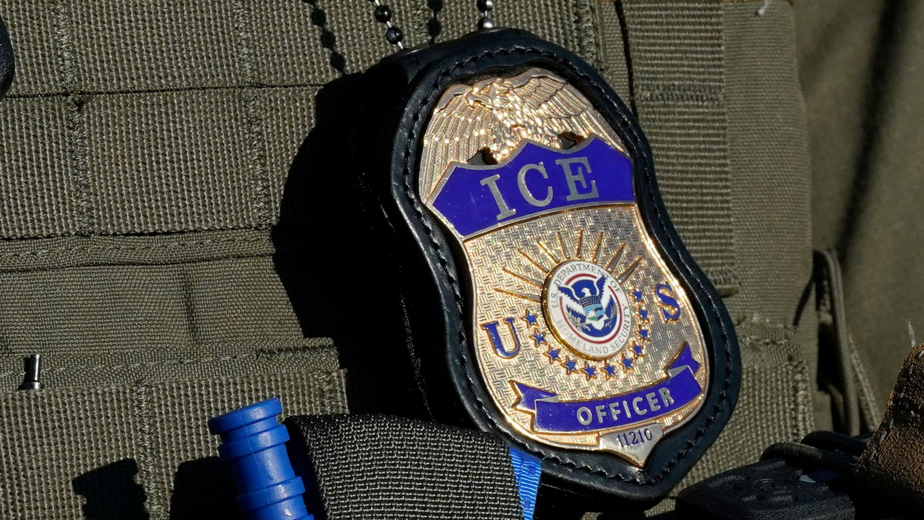 An Immigration and Customs Enforcement agent stands near an immigrant detention center in Elizabeth, New Jersey, on May 7, 2025.