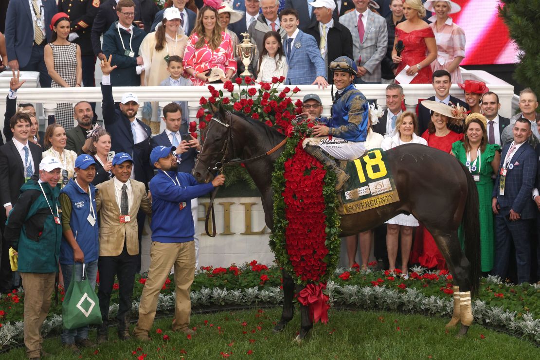 Alvarado poses atop of Sovereignty in the winners circle after winning the 151st running of the Kentucky Derby.