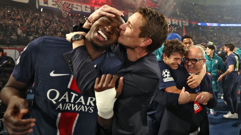 TOPSHOT - PSG's players celebrate their victory at the end of the UEFA Champions League semi-final second leg football match between Paris Saint-Germain (PSG) and Arsenal at the Parc des Princes stadium in Paris, on May 7, 2025. (Photo by FRANCK FIFE / AFP) (Photo by FRANCK FIFE/AFP via Getty Images)