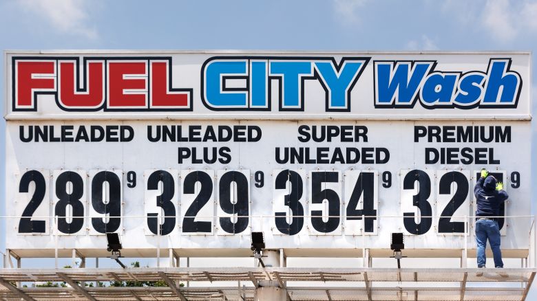 A worker changes the diesel price on a sign at a Fuel City gas station in Dallas, Texas, US, on Wednesday, May 7, 2025.