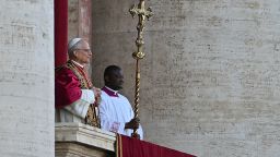 Newly elected Pope Robert Francis Prevost arrives on the main central loggia balcony of the St Peter's Basilica for the first time, after the cardinals ended the conclave, in The Vatican, on May 8, 2025. Robert Francis Prevost was on Thursday elected the first pope from the United States, the Vatican announced. A moderate who was close to Pope Francis and spent years as a missionary in Peru, he becomes the Catholic Church's 267th pontiff, taking the papal name Leo XIV. (Photo by Andrej ISAKOVIC / AFP) (Photo by ANDREJ ISAKOVIC/AFP via Getty Images)          