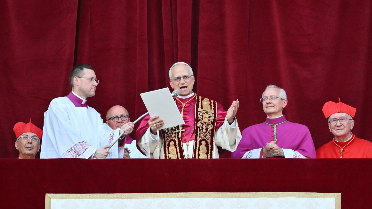 Newly elected Pope Leo XIV, Robert Prevost addresses the crowd from the main central loggia balcony of the St Peter's Basilica for the first time, after the cardinals ended the conclave, in The Vatican, on May 8, 2025. Robert Francis Prevost was on Thursday elected the first pope from the United States, the Vatican announced. A moderate who was close to Pope Francis and spent years as a missionary in Peru, he becomes the Catholic Church's 267th pontiff, taking the papal name Leo XIV. (Photo by Alberto PIZZOLI / AFP) (Photo by ALBERTO PIZZOLI/AFP via Getty Images)          