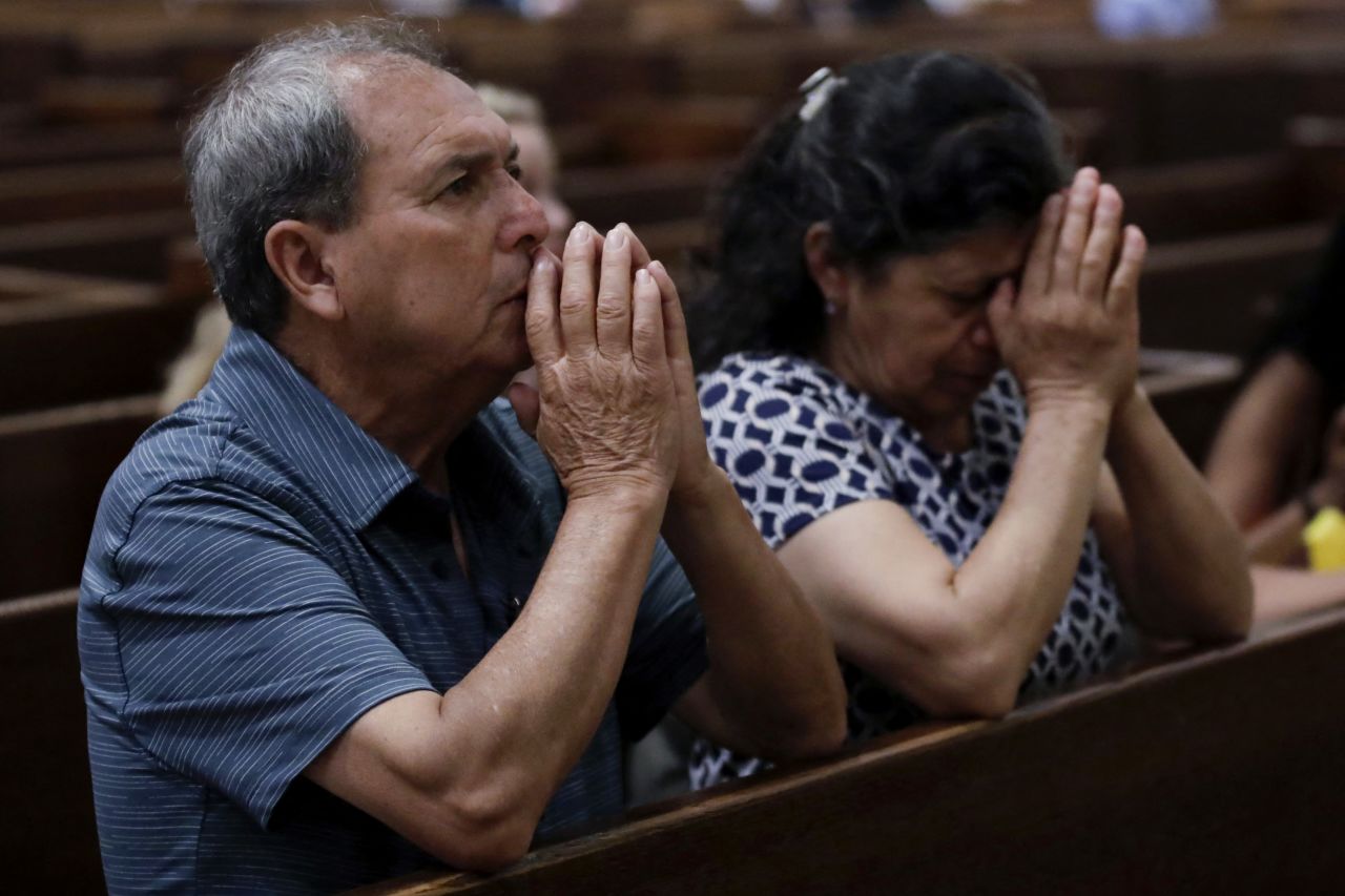 People react to the selection of newly elected Pope Leo at Saint Patricks Cathedral in New York on Thursday.
