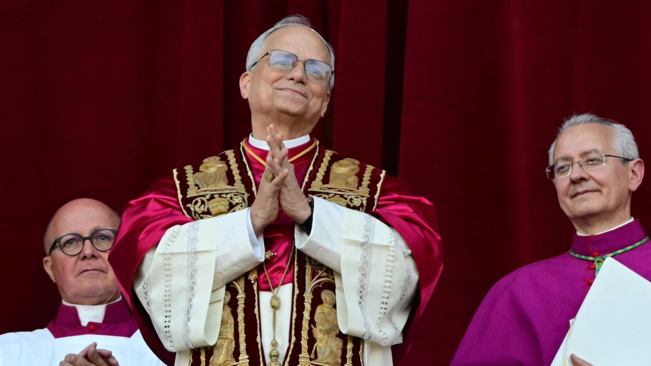 Newly elected Pope Leo XIV, Robert Prevost addresses the crowd from the main central loggia balcony of the St Peter's Basilica for the first time, after the cardinals ended the conclave, in The Vatican, on May 8, 2025. Robert Francis Prevost was on Thursday elected the first pope from the United States, the Vatican announced. A moderate who was close to Pope Francis and spent years as a missionary in Peru, he becomes the Catholic Church's 267th pontiff, taking the papal name Leo XIV. (Photo by Tiziana FABI / AFP) (Photo by TIZIANA FABI/AFP via Getty Images)