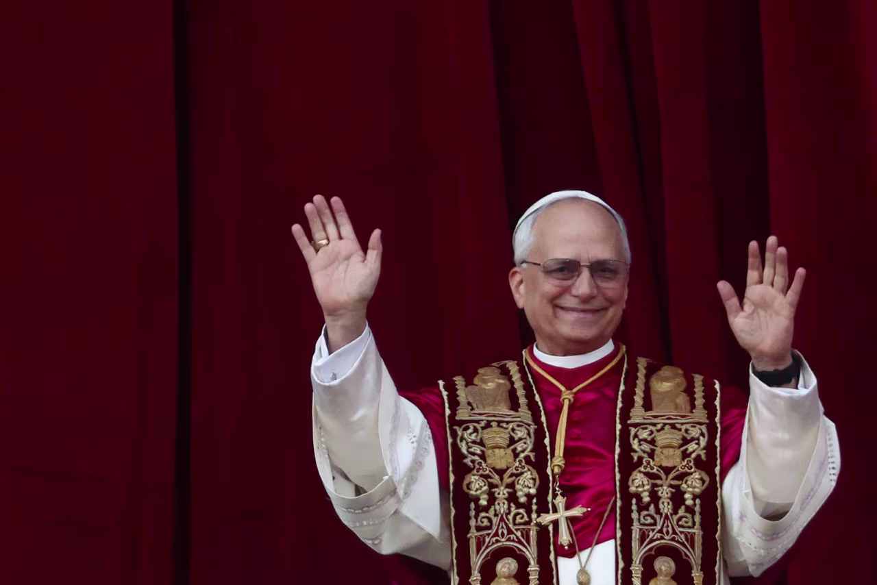 Newly elected Pope Leo waves from the balcony at Saint Peter's Basilica on Thursday.