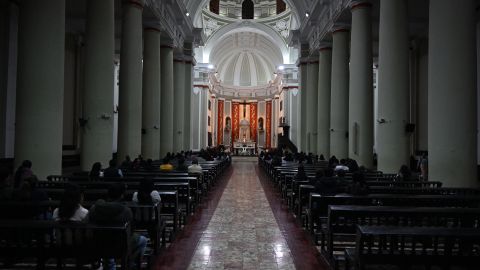 Faithful attend mass at the cathedral of Chiclayo in northern Peru on May 8, 2025. US-born pontiff Robert Francis Prevost, close to Pope Francis, became a Peruvian national in 2015 and devoted more than 20 years as a missionary in Peru. (Photo by ERNESTO BENAVIDES / AFP) (Photo by ERNESTO BENAVIDES/AFP via Getty Images)          