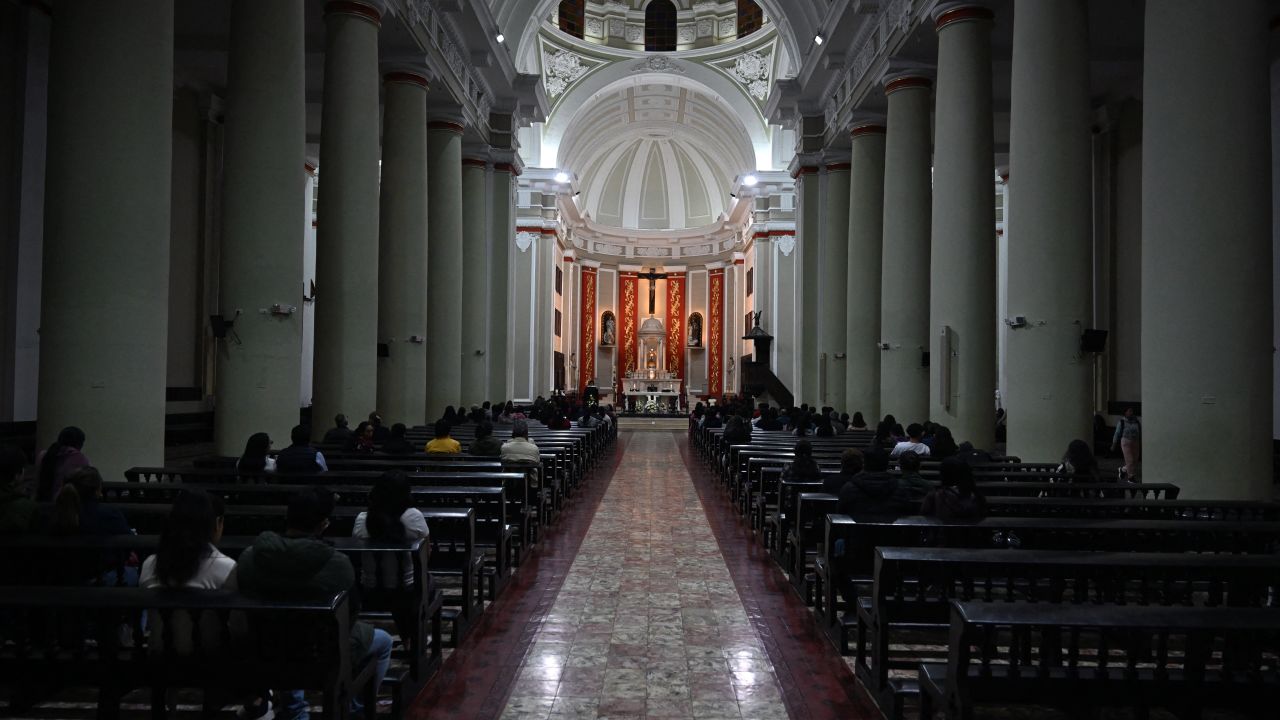 Faithful attend mass at the cathedral of Chiclayo in northern Peru on May 8, 2025. US-born pontiff Robert Francis Prevost, close to Pope Francis, became a Peruvian national in 2015 and devoted more than 20 years as a missionary in Peru. (Photo by ERNESTO BENAVIDES / AFP) (Photo by ERNESTO BENAVIDES/AFP via Getty Images)          