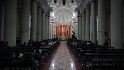 Faithful attend mass at the cathedral of Chiclayo in northern Peru on May 8, 2025. US-born pontiff Robert Francis Prevost, close to Pope Francis, became a Peruvian national in 2015 and devoted more than 20 years as a missionary in Peru. (Photo by ERNESTO BENAVIDES / AFP) (Photo by ERNESTO BENAVIDES/AFP via Getty Images)          