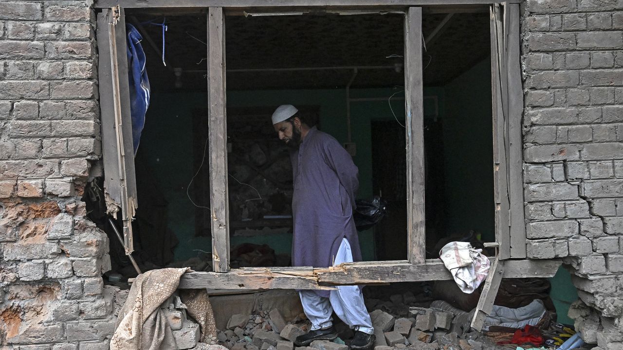 TOPSHOT - A local resident inspects his house that was damaged by Pakistani artillery shelling in Uri, about 100kms from Srinagar, on May 9, 2025. India said on May 9 it had repulsed a wave of Pakistani drone and artillery attacks overnight, and Islamabad insisted it had not struck targets across the border, as the latest conflict between the nuclear-armed neighbours showed no signs of relenting. (Photo by Tauseef MUSTAFA / AFP) (Photo by TAUSEEF MUSTAFA/AFP via Getty Images)          