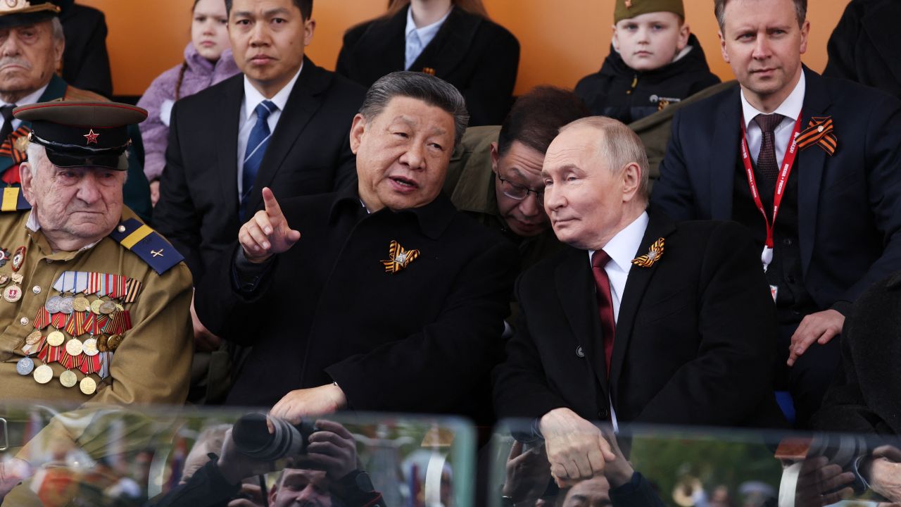 In this pool photograph distributed by the Russian state agency Sputnik, Russia's President Vladimir Putin and Chinese President Xi Jinping attend the Victory Day military parade at Red Square in central Moscow on May 9, 2025. Russia celebrates the 80th anniversary of the Soviet Union's victory over Nazi Germany in World War Two (WWII). (Photo by Vyacheslav PROKOFYEV / POOL / AFP) (Photo by VYACHESLAV PROKOFYEV/POOL/AFP via Getty Images)          