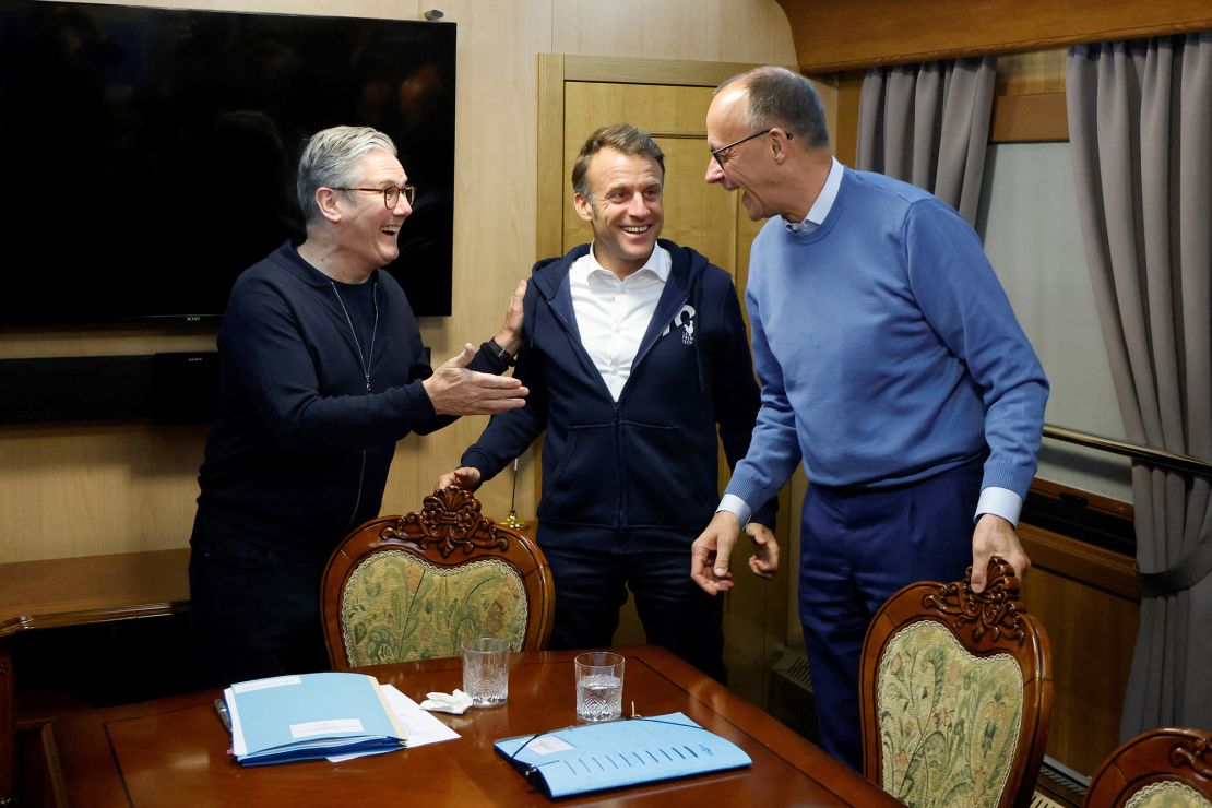 UK Prime Minister Keir Starmer, left, gestures during a trilateral meeting with Macron, center, and Merz, right, on board a train to Kyiv, in Shegyni, Ukraine, on May 9, 2025.